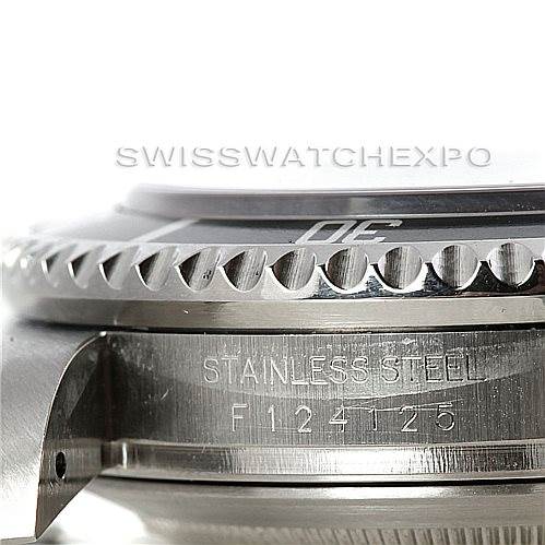 This image shows a close-up view of the case and part of the bezel of a Rolex Sea-Dweller 16600 Men's Stainless Steel Black Dial 16600 Men's Stainless Steel Black Dial watch, highlighting the stainless steel material and serial number engraving.