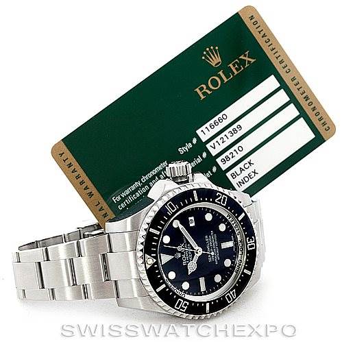 The image shows a Rolex Sea-Dweller 116660 Men
s Stainless Steel Black Dial 116660 Men
s Stainless Steel Black Dial watch with its side and front angles visible, accompanied by its chronometer certification card in the background.
