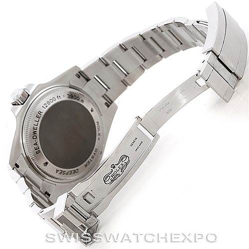 The image shows the back and bracelet of a Rolex Sea-Dweller 116660 Men
s Stainless Steel Black Dial 116660 Men
s Stainless Steel Black Dial watch, partially opened to display the clasp and case back.