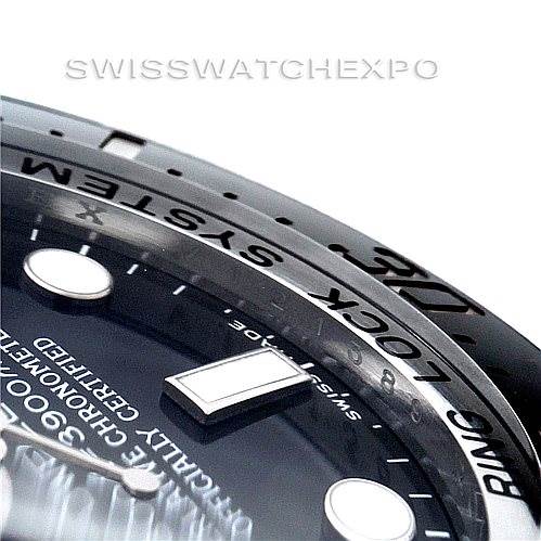 This close-up image shows the bezel and part of the dial of the Rolex Sea-Dweller 116660 Men
s Stainless Steel Black Dial 116660 Men
s Stainless Steel Black Dial watch.