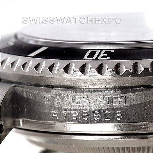 The image shows a close-up angled view of the case side of a Rolex Sea-Dweller 16600 Men
s Stainless Steel Black Dial 16600 Men
s Stainless Steel Black Dial watch, highlighting the bezel and "STAINLESS STEEL" engraving.