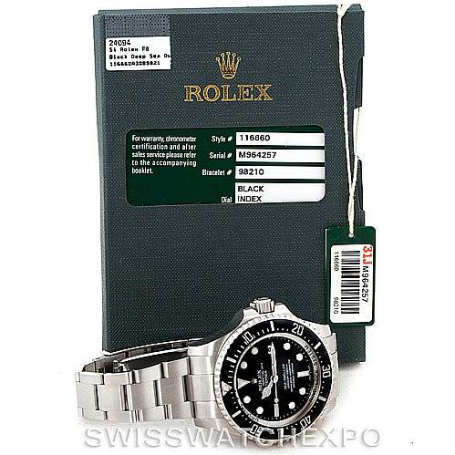 The Rolex Sea-Dweller 116660 Men's Stainless Steel Black Dial 116660 Men's Stainless Steel Black Dial watch is shown front-facing with its box, warranty, and hangtag accessories.
