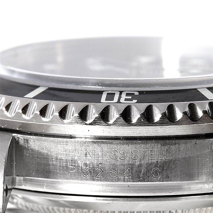 This image shows a close-up angle of the bezel and case, including the serial number, of a Rolex Sea-Dweller 16600 Men's Stainless Steel Black Dial 16600 Men's Stainless Steel Black Dial watch.