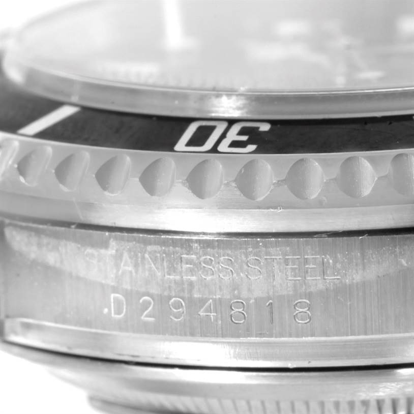 The image shows a close-up of the bezel and part of the case edge with an engraving of a Rolex Sea-Dweller 16600 Men
s Stainless Steel Black Dial 16600 Men
s Stainless Steel Black Dial watch.