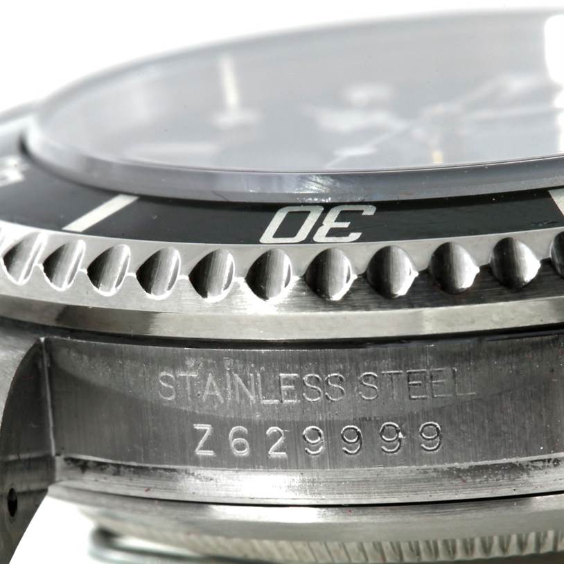 This close-up angle shows the bezel and case side of the Rolex Sea-Dweller 16600 Men's Stainless Steel Black Dial 16600 Men's Stainless Steel Black Dial watch, including its serial number.