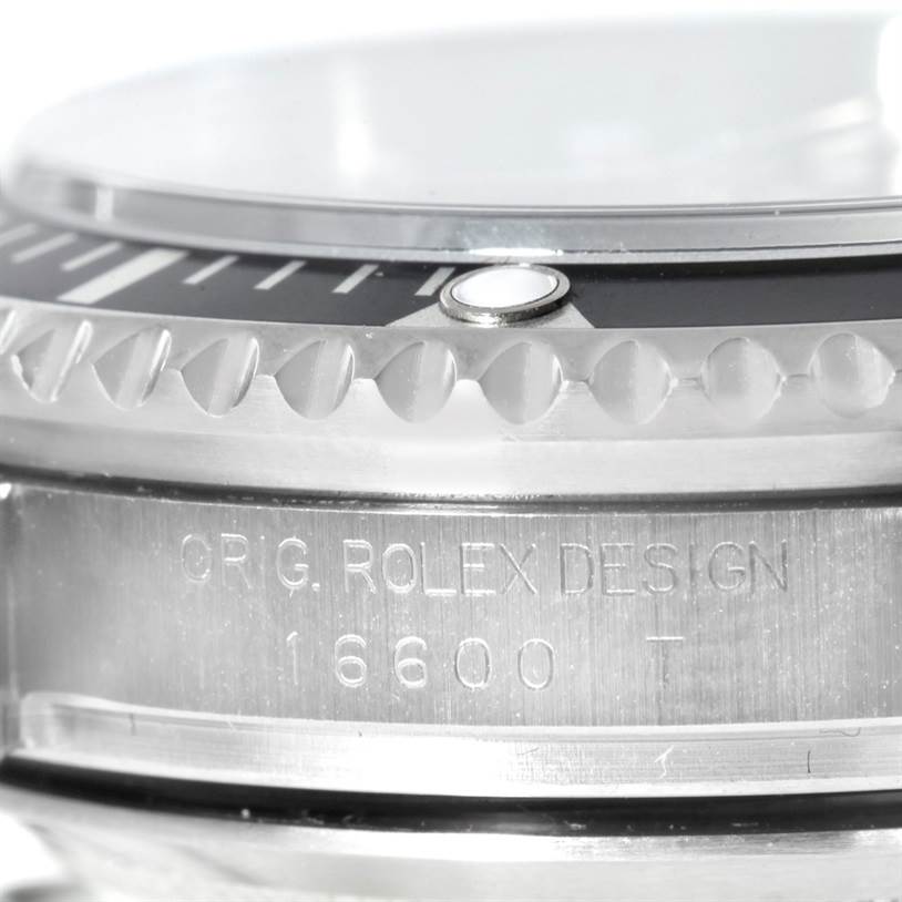 The image shows a close-up of the bezel, crystal, and case side of a Rolex Sea-Dweller 16600 Men
s Stainless Steel Black Dial 16600 Men
s Stainless Steel Black Dial watch, highlighting the model number 16600.