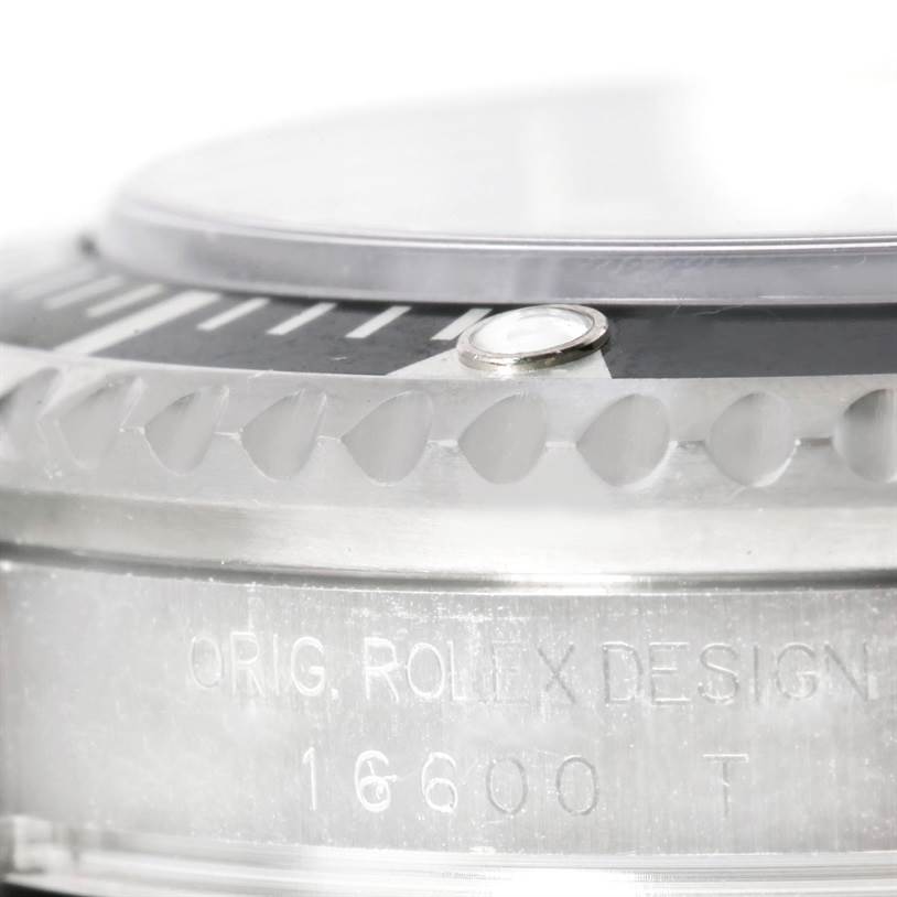 The image shows a close-up of the bezel and case side of the Rolex Sea-Dweller 16600 Men's Stainless Steel Black Dial 16600 Men's Stainless Steel Black Dial 16600.