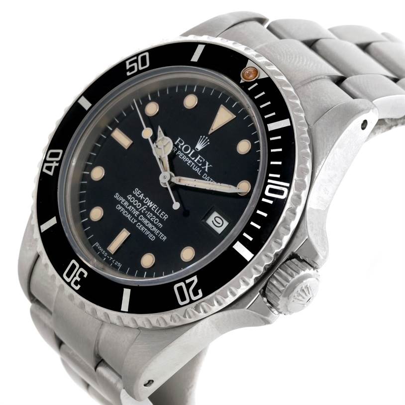 The image shows a close-up side angle of a Rolex Sea-Dweller 16660 Men's Stainless Steel Black Dial 16660 Men's Stainless Steel Black Dial watch, highlighting its face, bezel, crown, and metal bracelet.