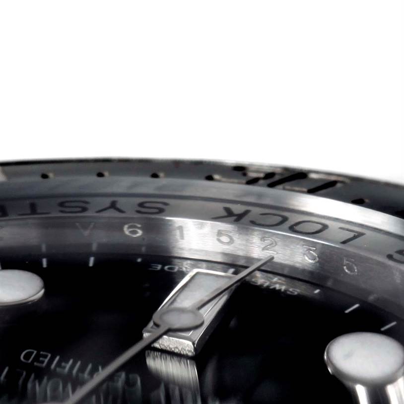 The image shows a close-up angle of the bezel and part of the dial of a Rolex Sea-Dweller 116660 Men's Stainless Steel Black Dial 116660 Men's Stainless Steel Black Dial watch.