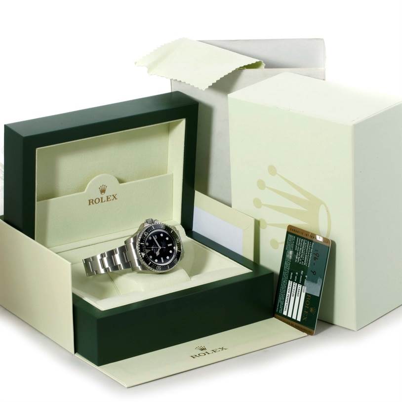 The image shows a Rolex Sea-Dweller 116660 Men's Stainless Steel Black Dial 116660 Men's Stainless Steel Black Dial watch inside its open box, alongside its packaging and warranty card.