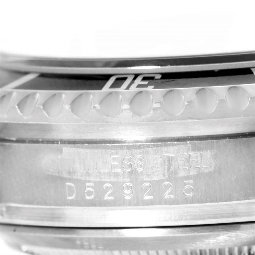 The image shows a close-up of the bezel and serial number engraving on the stainless steel case of a Rolex Sea-Dweller 16600 Men's Stainless Steel Black Dial 16600 Men's Stainless Steel Black Dial watch.