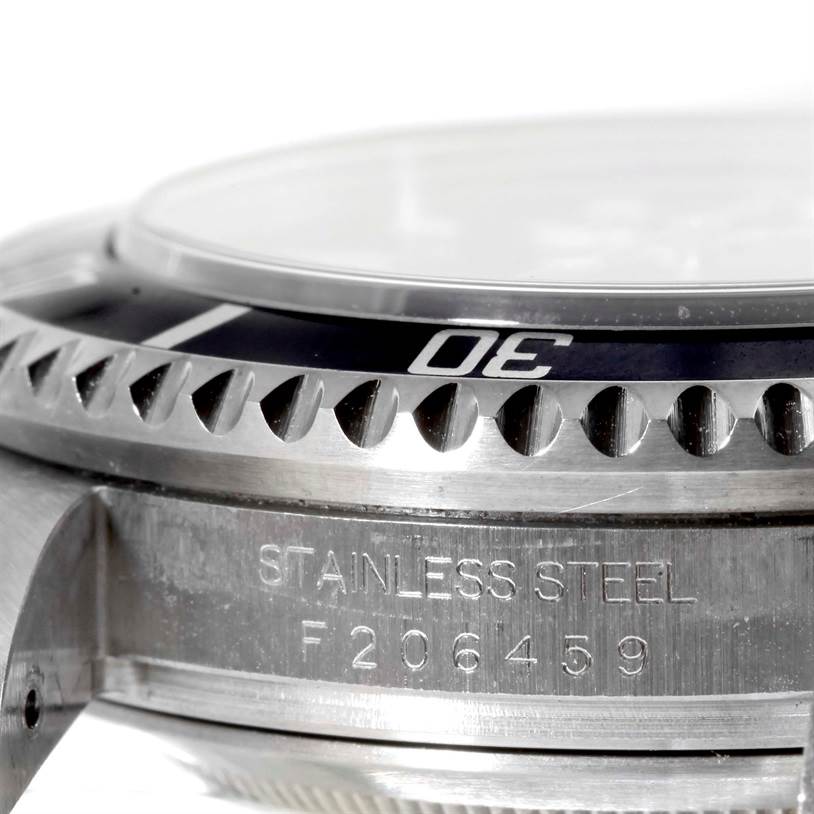 This close-up image of a Rolex Sea-Dweller 16600 Men's Stainless Steel Black Dial 16600 Men's Stainless Steel Black Dial watch shows the stainless steel case and part of the rotating bezel.