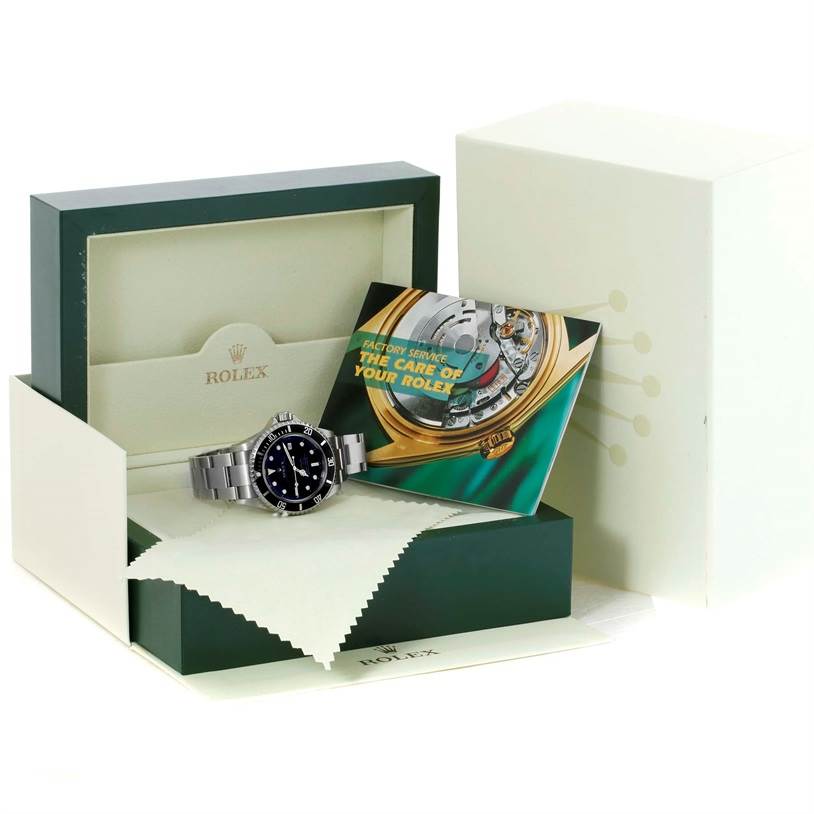 The image shows a Rolex Sea-Dweller 16600 Men's Stainless Steel Black Dial 16600 Men's Stainless Steel Black Dial watch in its open box with a brochure and cleaning cloth.
