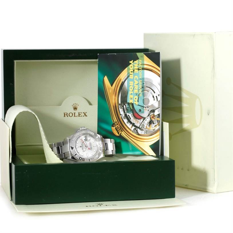 The Rolex Yacht-Master 16622 Men's Stainless Steel Silver Dial 16622 Men's Stainless Steel Silver Dial watch is shown in its green box along with a booklet and accompanying packaging.