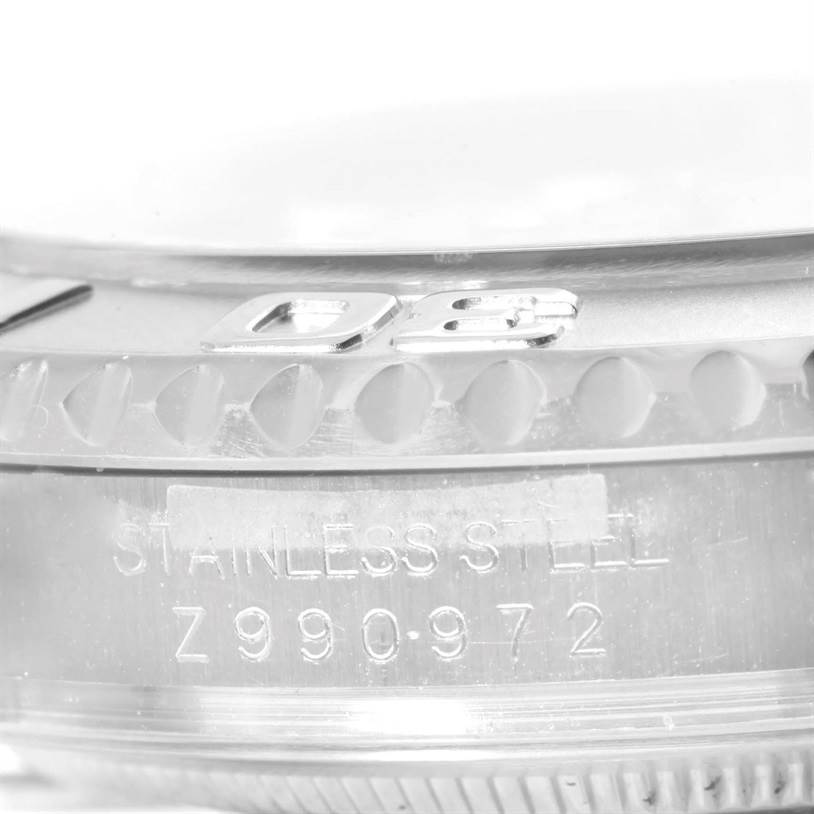 The image shows a close-up side view of the bezel and part of the case back of a Rolex Yacht-Master 16622 Men's Stainless Steel Silver Dial 16622 Men's Stainless Steel Silver Dial watch, with the serial number visible.