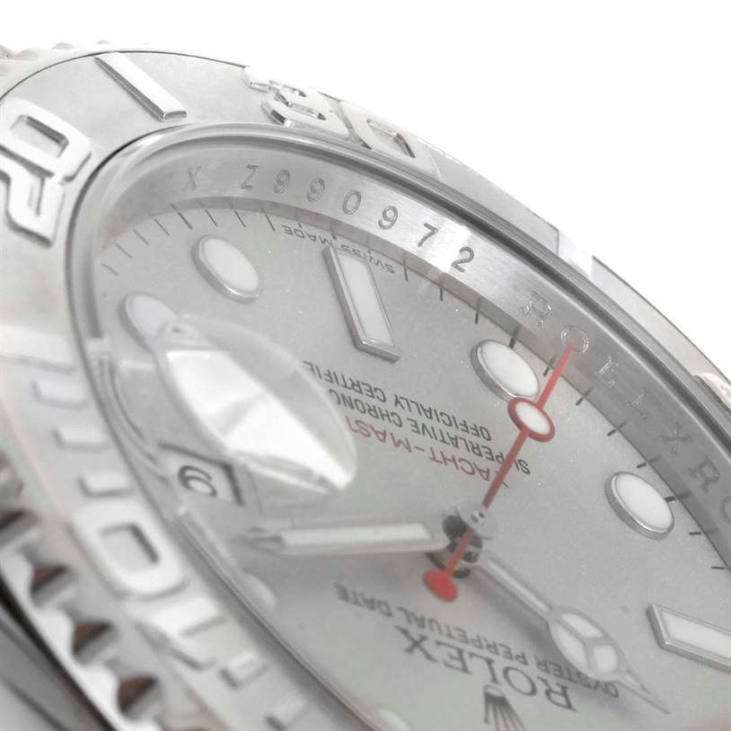 The image shows a close-up of the Rolex Yacht-Master 16622 Men's Stainless Steel Silver Dial 16622 Men's Stainless Steel Silver Dial watch face, including the bezel, dial, hands, and part of the date magnifier.
