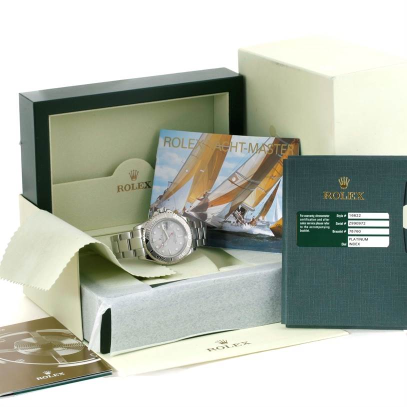 The image shows a Rolex Yacht-Master 16622 Men's Stainless Steel Silver Dial 16622 Men's Stainless Steel Silver Dial watch and its accessories, including the box, booklets, and certification.