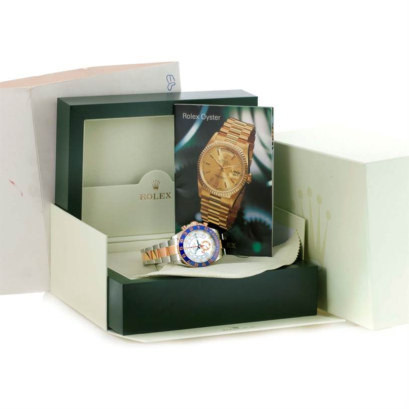 The image shows the Rolex Yacht-Master 116681 Men's Steel and Gold (two tone) White Dial 116681 Men's Steel and Gold (two tone) White Dial watch along with its box, instruction manual, and outer packaging, viewed from the front.