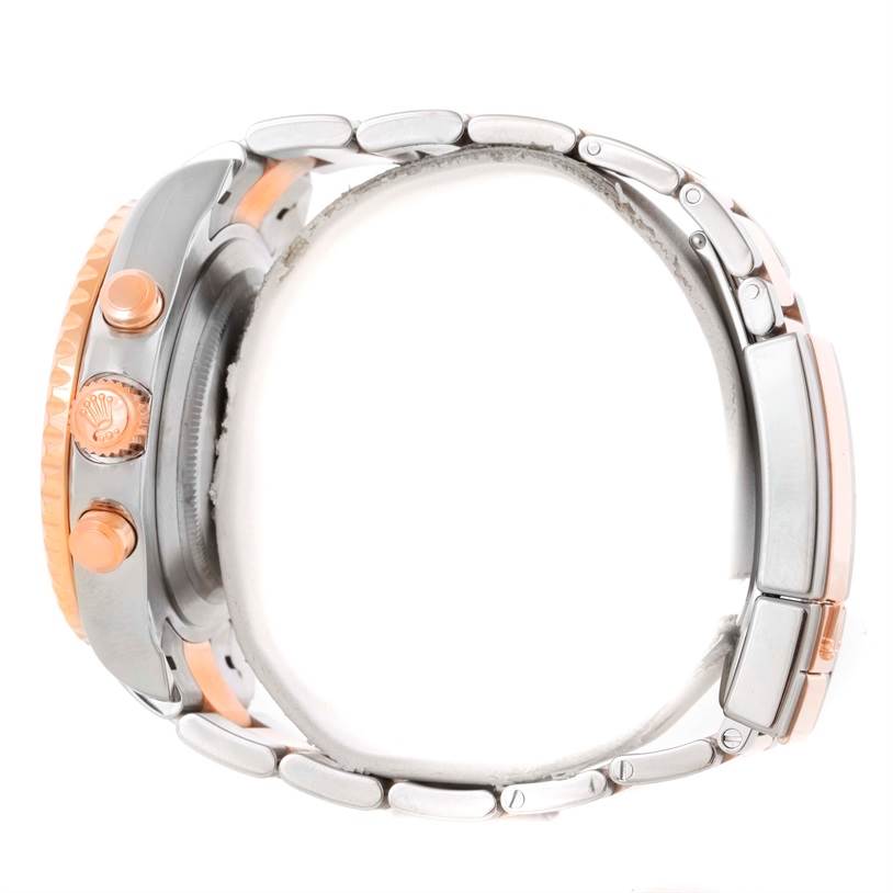 The image shows a side view of a Rolex Yacht-Master 116681 Men's Steel and Gold (two tone) White Dial 116681 Men's Steel and Gold (two tone) White Dial watch, highlighting its bezel, crown, pushers, and bracelet.