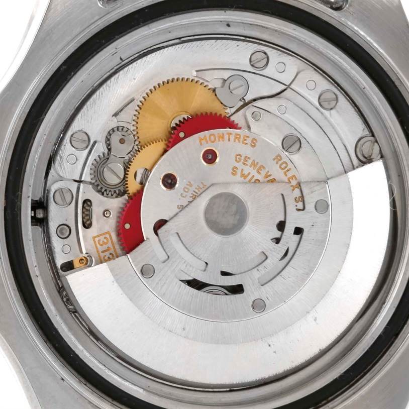 The image shows the internal mechanism of a Rolex Yacht-Master 16622 Men
s Stainless Steel Silver Dial 16622 Men
s Stainless Steel Silver Dial watch from the back angle, revealing gears and the rotor.