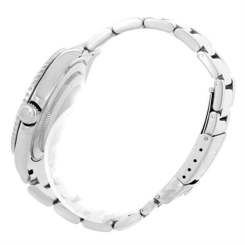 This side view of the Rolex Yacht-Master 16622 Men
s Stainless Steel Silver Dial 16622 Men
s Stainless Steel Silver Dial watch highlights its crown, case, and metal bracelet.