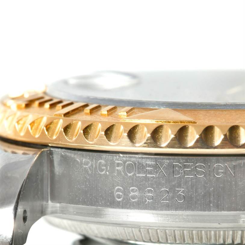 The image shows a close-up view of the side of a Rolex Yacht-Master 68623 Men's Stainless Steel Blue Dial 68623 Men's Stainless Steel Blue Dial watch, highlighting the model number engraving and bezel detail.