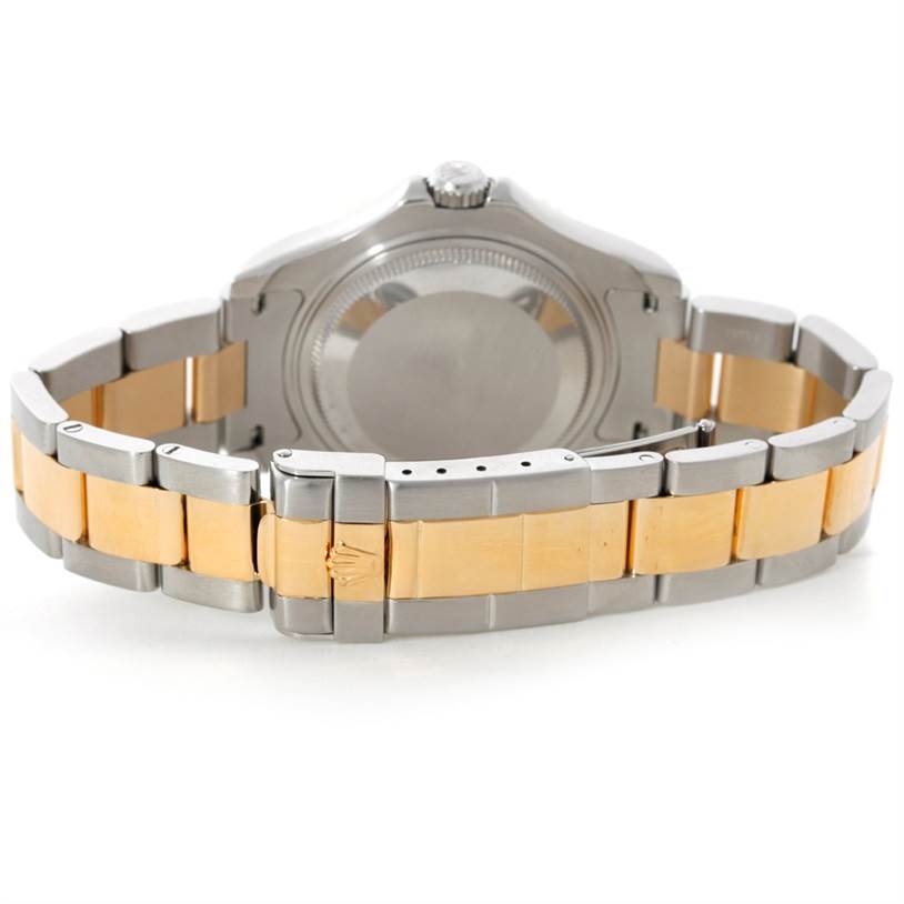 This image shows the back and the bracelet of a Rolex Yacht-Master 68623 Men's Stainless Steel Blue Dial 68623 Men's Stainless Steel Blue Dial watch, featuring a metal and gold link design.