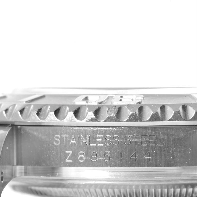 This image shows a close-up side view of the bezel and case of a Rolex Yacht-Master 16622 Men's Stainless Steel Silver Dial 16622 Men's Stainless Steel Silver Dial watch, focusing on the engravings.