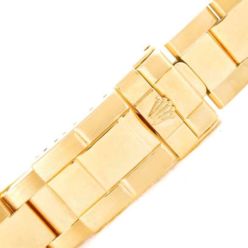 This image shows a close-up of the gold bracelet clasp of a Rolex Yacht-Master 68628 Men's Yellow Gold White Dial 68628 Men's Yellow Gold White Dial watch.