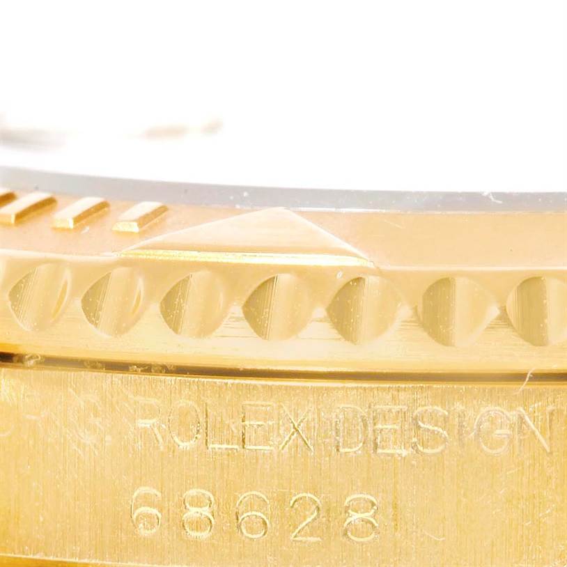 This close-up shows the bezel, case, and model number of a Rolex Yacht-Master 68628 Men's Yellow Gold White Dial 68628 Men's Yellow Gold White Dial watch.