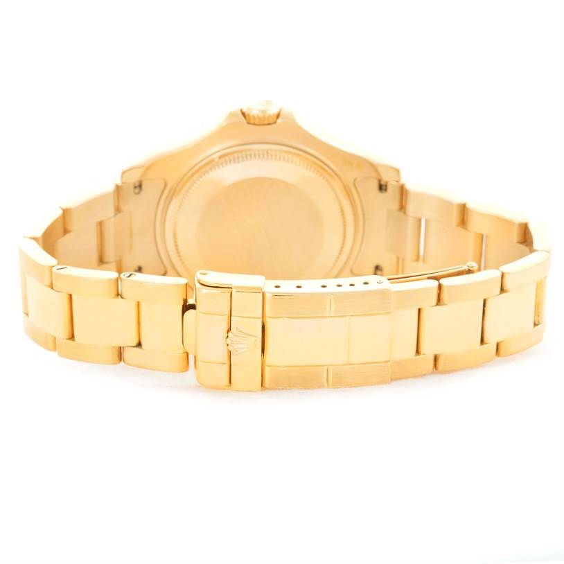 The image shows the back view of a Rolex Yacht-Master 68628 Men's Yellow Gold White Dial 68628 Men's Yellow Gold White Dial watch, highlighting the bracelet, clasp, and case back.