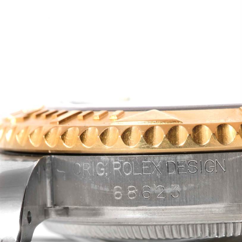 This image shows a close-up side view of the case and bezel of a Rolex Yacht-Master 68623 Men's Stainless Steel Blue Dial 68623 Men's Stainless Steel Blue Dial watch, highlighting the model engraving.