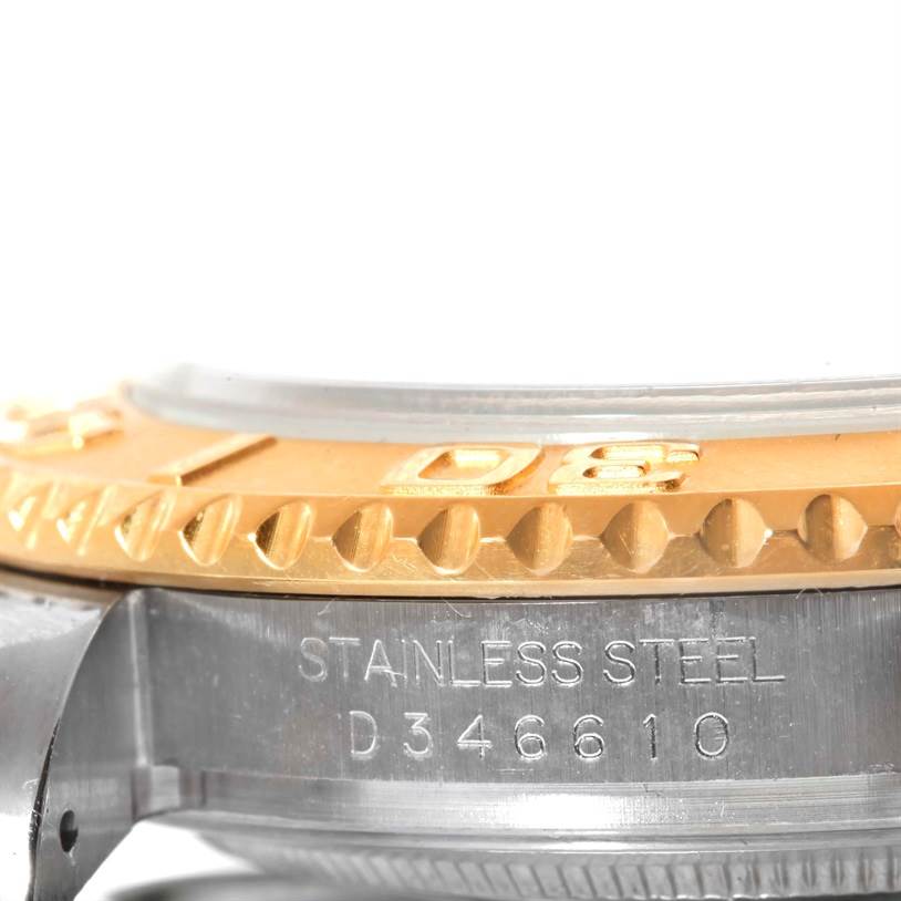 This image shows a close-up side view of the bezel and case back of the Rolex Yacht-Master 16623 Men's Stainless Steel White Dial 16623 Men's Stainless Steel White Dial watch, highlighting "STAINLESS STEEL" and a serial number.