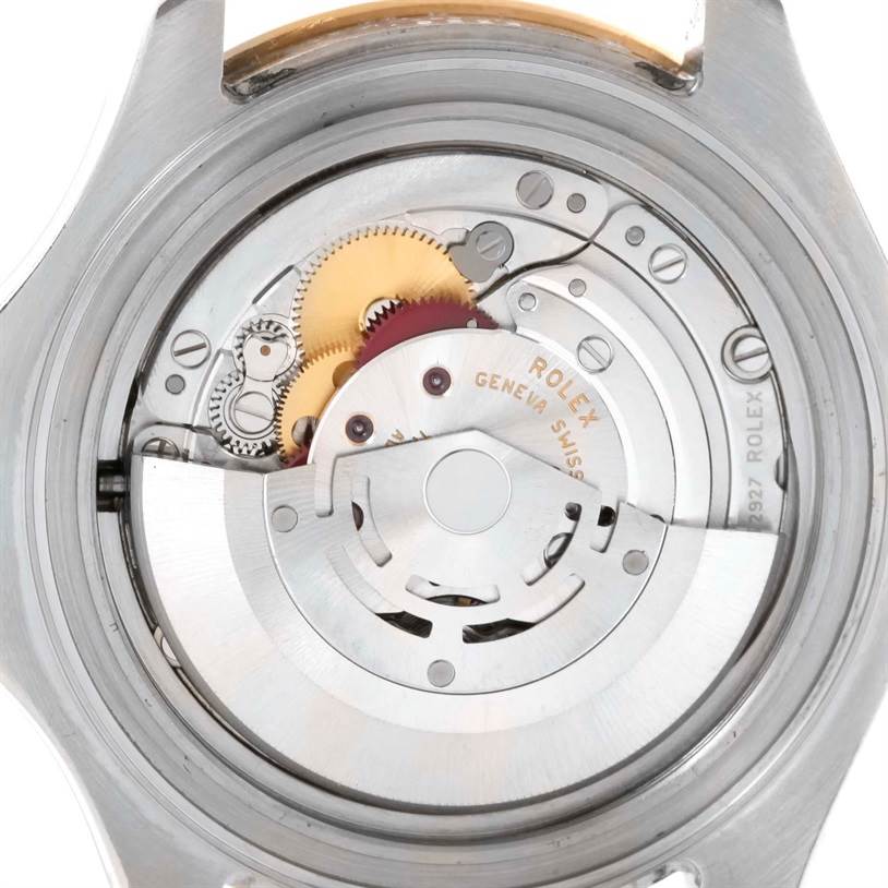 This image shows a close-up of the Rolex Yacht-Master 16623 Men's Stainless Steel White Dial 16623 Men's Stainless Steel White Dial watch's open case back, revealing its internal movement components.