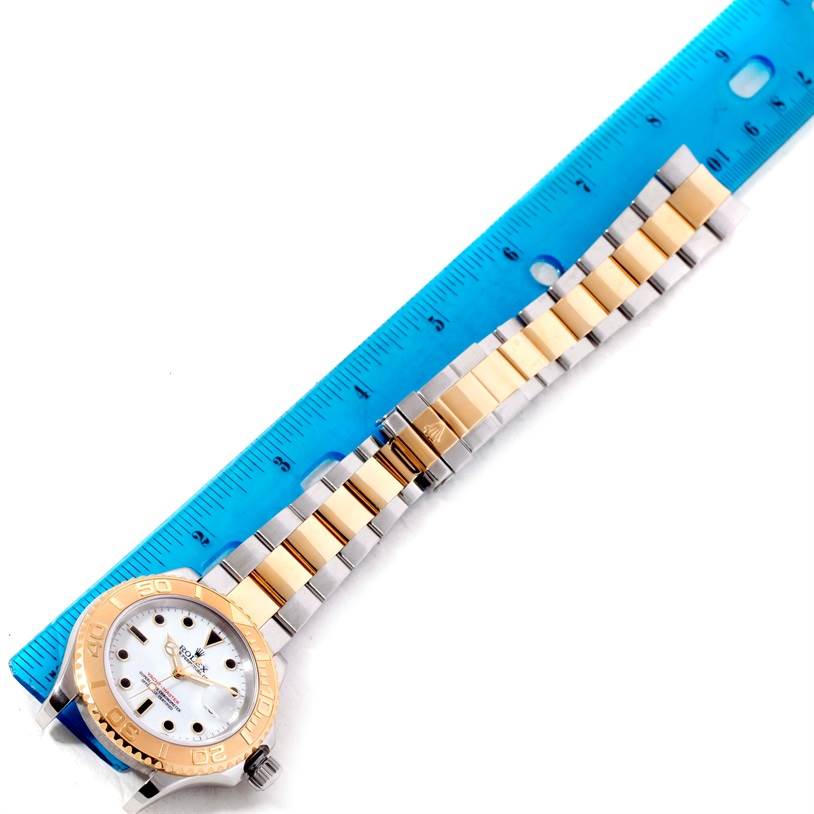 The image shows a Rolex Yacht-Master 16623 Men's Stainless Steel White Dial 16623 Men's Stainless Steel White Dial watch at a top-down angle, along with a blue ruler measuring its length.