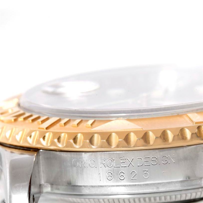 The image shows a close-up view of the side and bezel of the Rolex Yacht-Master 16623 Men's Stainless Steel Grey Dial 16623 Men's Stainless Steel Grey Dial watch.