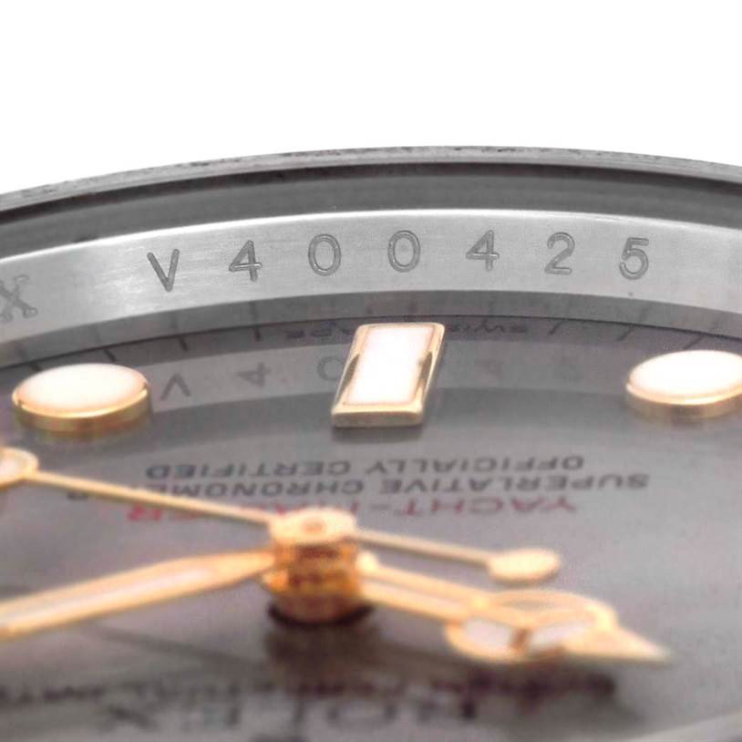 This image of the Rolex Yacht-Master 16623 Men's Stainless Steel Grey Dial 16623 Men's Stainless Steel Grey Dial watch shows a close-up angle of the dial, hands, and the engraved inner bezel with the model's serial number.