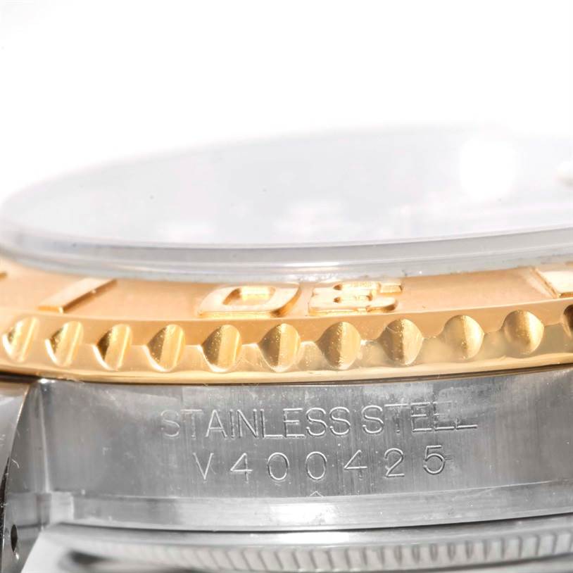 The image shows a close-up of the Rolex Yacht-Master 16623 Men's Stainless Steel Grey Dial 16623 Men's Stainless Steel Grey Dial watch bezel, case, and part of the serial number.