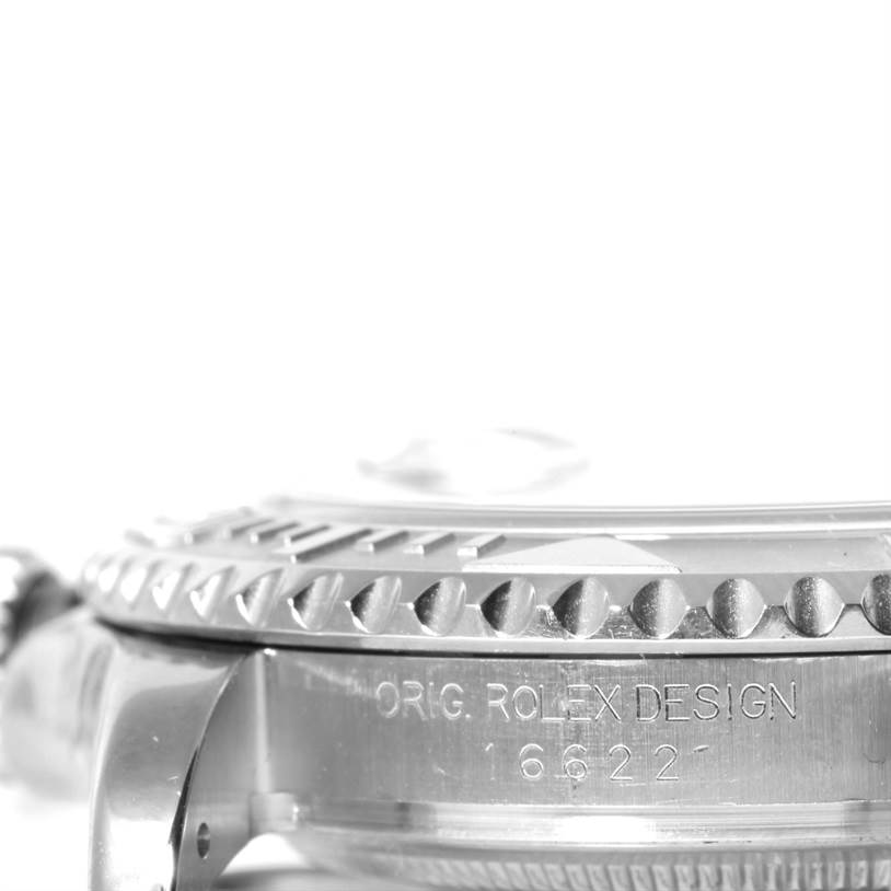 The side angle of the Rolex Yacht-Master 16622 Men's Stainless Steel Silver Dial 16622 Men's Stainless Steel Silver Dial watch showcases its bezel and engraved casing with "ORIG. ROLEX DESIGN 16622."