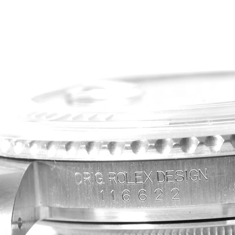 The image shows a close-up of the side of the bezel and case of a Rolex Yacht-Master 116622 Men's Stainless Steel Blue Dial 116622 Men's Stainless Steel Blue Dial watch, highlighting the engraving "ORIG. ROLEX DESIGN 116622."