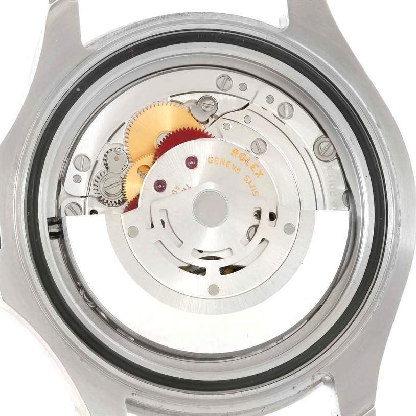 The image shows the back view of a Rolex Yacht-Master 116622 Men's Stainless Steel Blue Dial 116622 Men's Stainless Steel Blue Dial watch exposing its internal mechanical movement and gears.