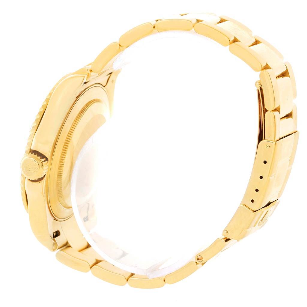 The image shows a side view of the gold bracelet and case of a Rolex Yacht-Master 16628 Men's Yellow Gold White Dial 16628 Men's Yellow Gold White Dial watch.