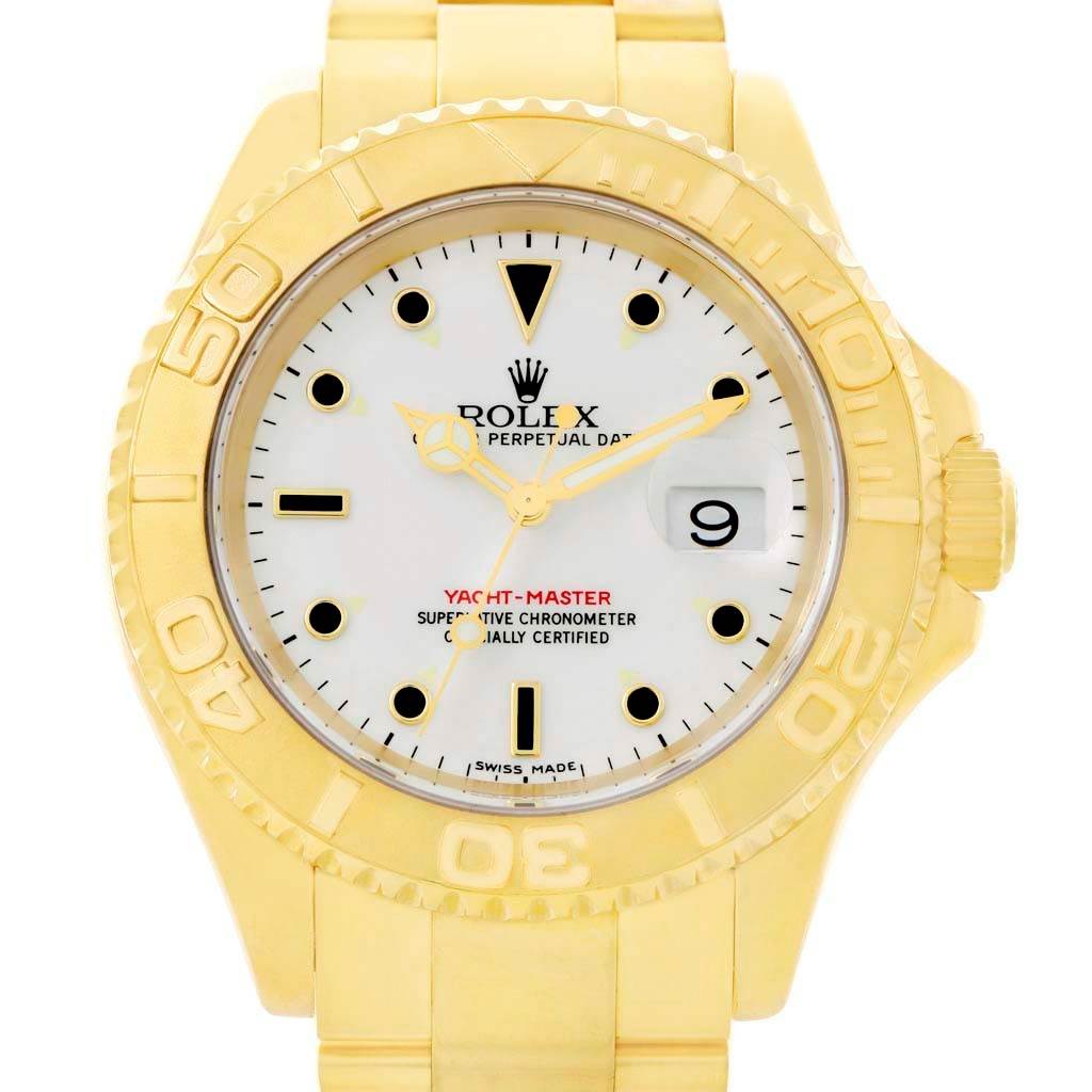 The image shows a front view of a Rolex Yacht-Master 16628 Men's Yellow Gold White Dial 16628 Men's Yellow Gold White Dial watch, highlighting the face, bezel, and part of the bracelet.