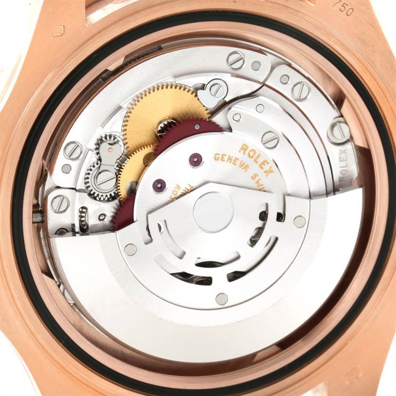 The image displays the internal mechanism of a Rolex Yacht-Master 116655 Men's Rose Gold Black Dial 116655 Men's Rose Gold Black Dial watch, showcasing gears and the rotor.