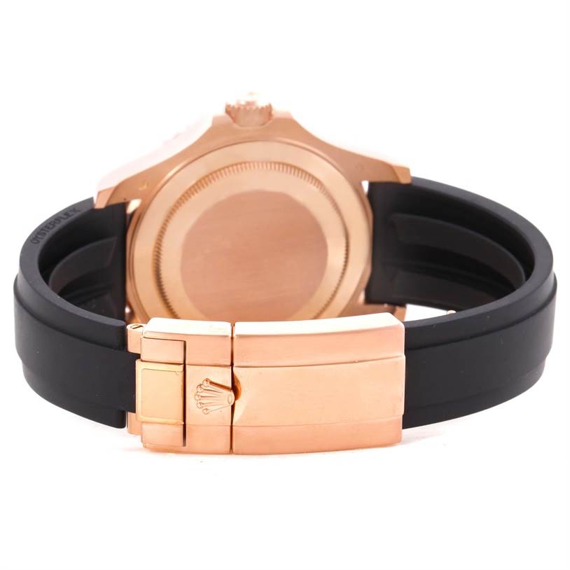 This image shows the back case and clasp of a Rolex Yacht-Master 116655 Men's Rose Gold Black Dial 116655 Men's Rose Gold Black Dial watch with a black strap.