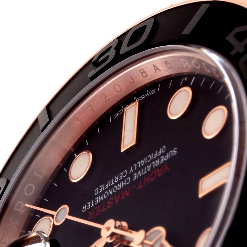 This close-up image of the Rolex Yacht-Master 116655 Men's Rose Gold Black Dial 116655 Men's Rose Gold Black Dial watch shows the dial, bezel, and part of the crown at an angle.