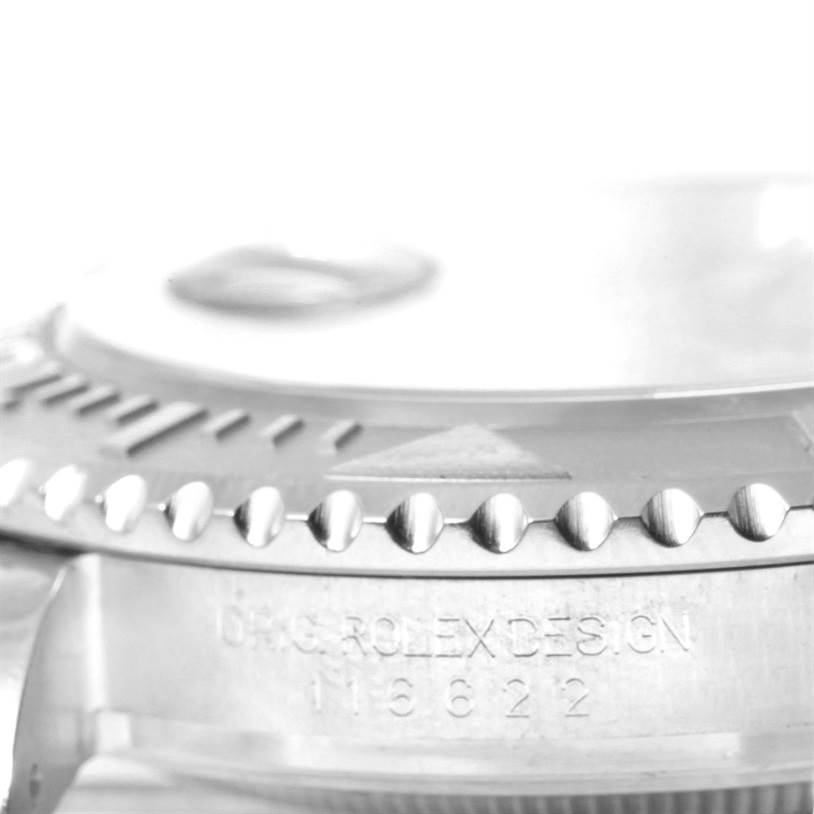 This close-up image of the Rolex Yacht-Master 116622 Men's Stainless Steel Blue Dial 116622 Men's Stainless Steel Blue Dial watch shows the bezel and case engraving with the model number.