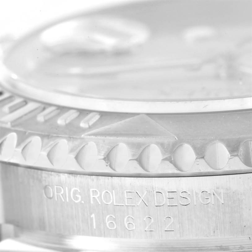 This close-up angle of the Rolex Yacht-Master 16622 Men's Stainless Steel Silver Dial 16622 Men's Stainless Steel Silver Dial shows the side of the bezel and case with the "Rolex Design 16622" engraving.