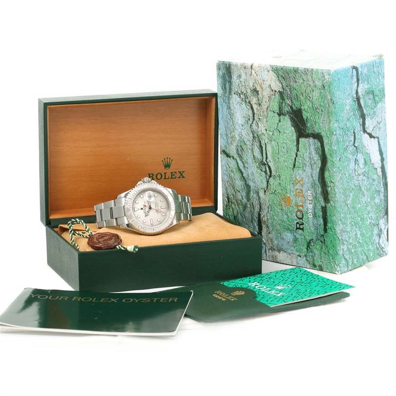 The Rolex Yacht-Master 16622 Men's Stainless Steel Silver Dial 16622 Men's Stainless Steel Silver Dial is displayed at an angle in an open box, with packaging and booklets included.