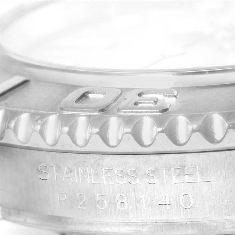 Close-up of the bezel and stainless steel case of a Rolex Yacht-Master 16622 Men's Stainless Steel Silver Dial 16622 Men's Stainless Steel Silver Dial watch, showing part of the Rolex branding and the serial number.